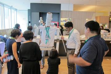 team collaborate to construct a puppet creative team building activity