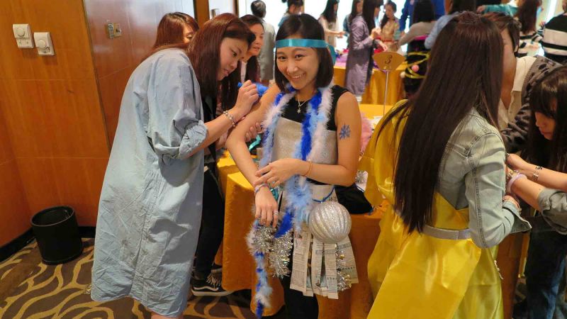 women dressed up for haute couture fun team building activity