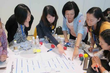 team collaborate in innovative team building game speak up speak out