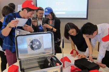 employees collaborating to complete beat the box team building activity