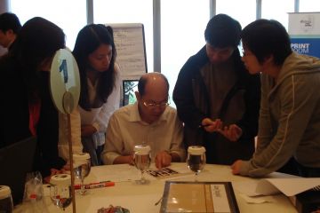 team collaborate at making the news team building activity