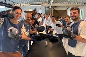 Indoor team building experience focused on trust, planning and coordination