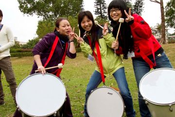 women having fun collaborating beatswork team building activity