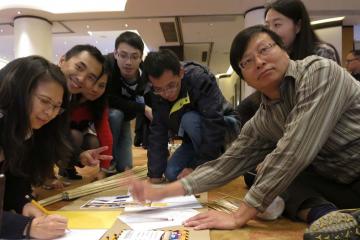 team works to complete team building creative challenge AI