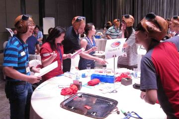 team collaborate to make juices in creative juices team building activity