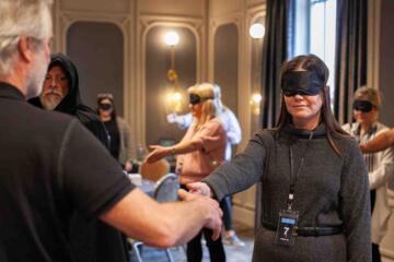 Team members communicating under pressure in an interactive corporate team building exercise