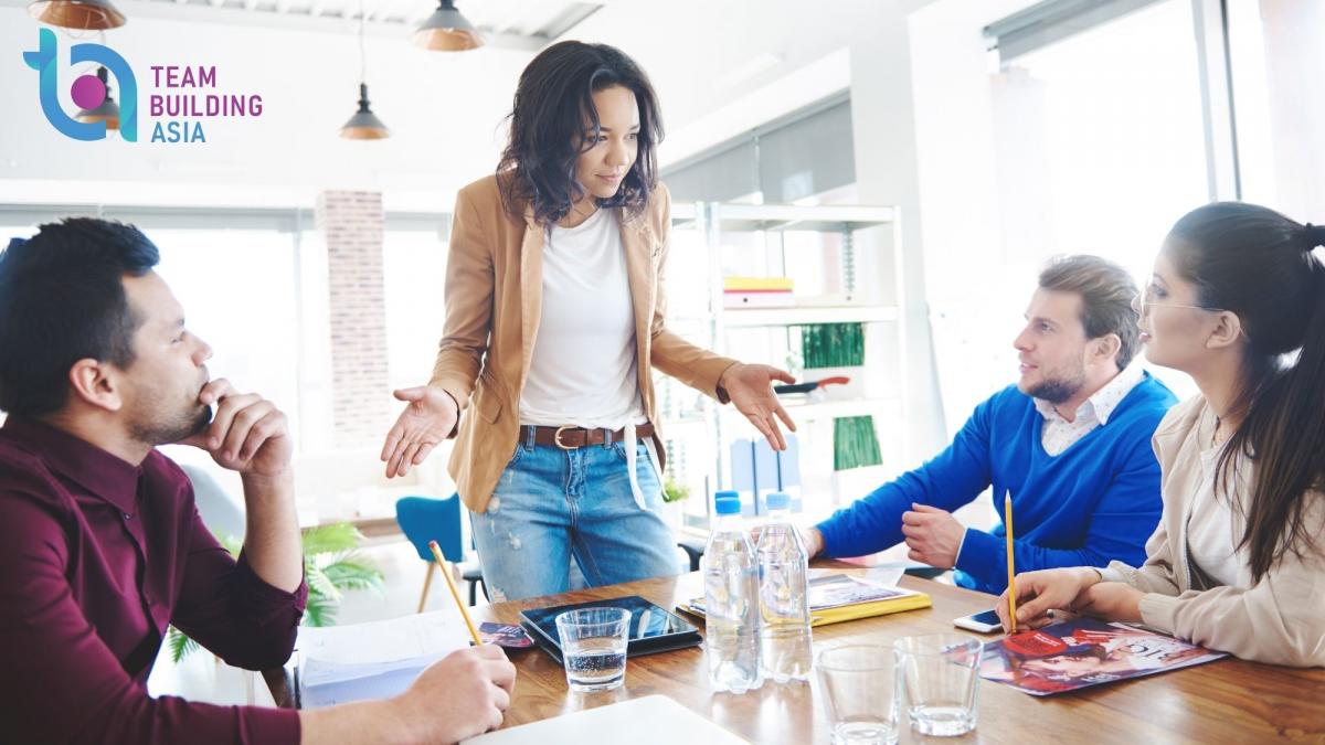 team leader trying to motivate three team mates