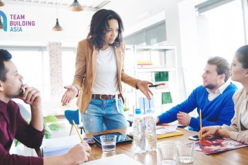 team leader trying to motivate three team mates