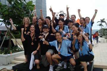 employees collaborate to complete breakthrough team building activity