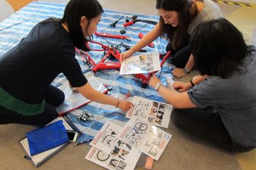 women collaborate to complete building a dream team building activity