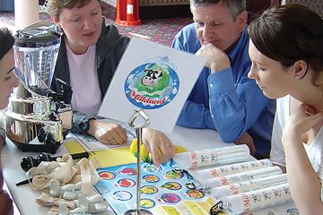 team of people creating strategy in business game catalyst team building business game creative juices