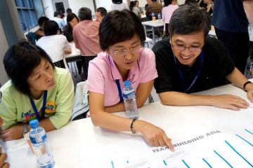 team collaborate in innovative team building game speak up speak out