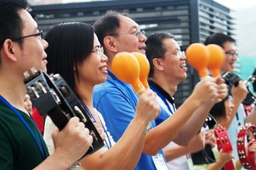 employees having fun beatswork team building activity