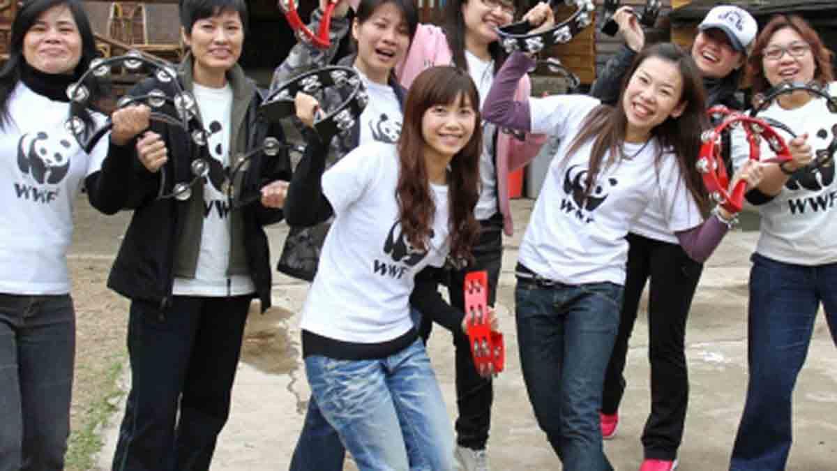 Young people with black hair laughing and smiling after participating in Catalyst team building program Beatswork