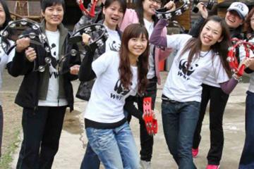 Young people with black hair laughing and smiling after participating in Catalyst team building program Beatswork