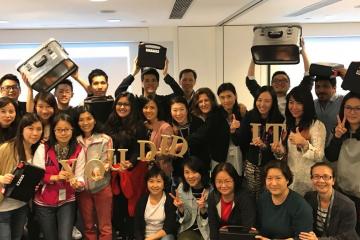 smiley employees pose for group picture 2009