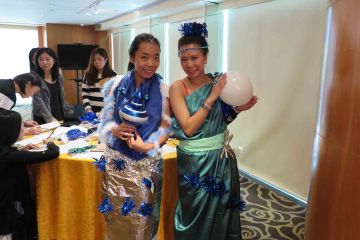 two women dressed up for haute couture team building activity