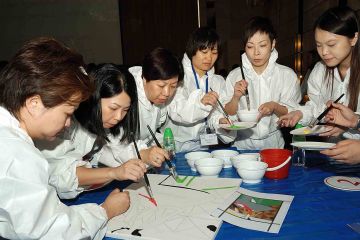 team collaborate to draw a giant picture creative team building activity