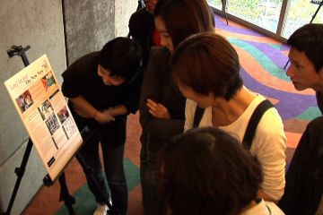 employees look at a board