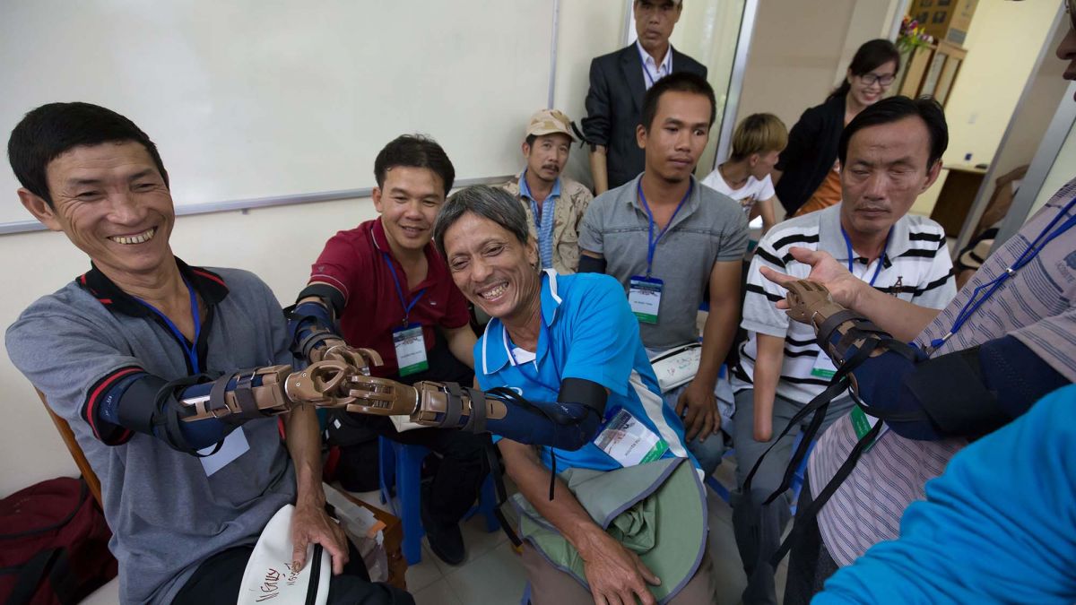 group of people smiling helping the community