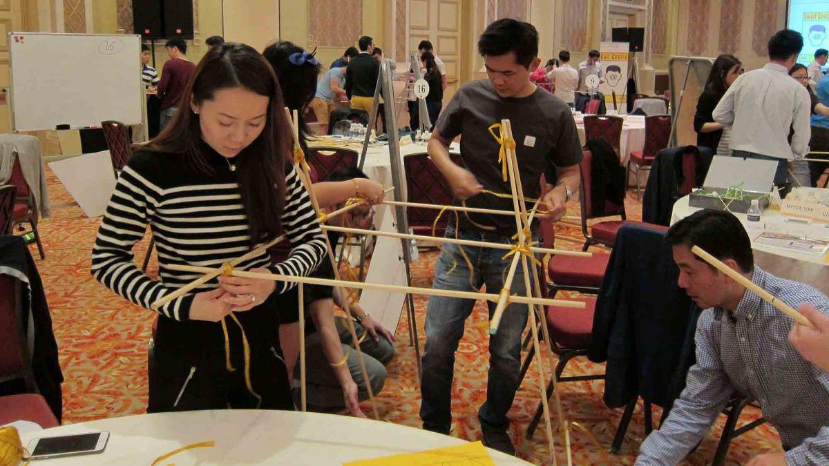 team collaborate to build a giant bridge giant
