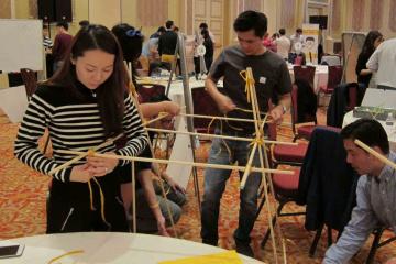 team collaborate to build a giant bridge giant