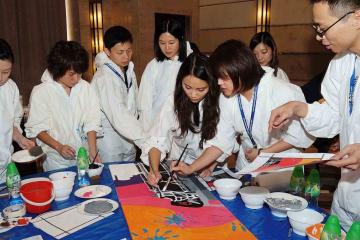 team collaborate to paint a big picture creative team building activity bp