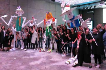 group photo puppet masters team building activity