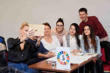 taking selfie playing impact