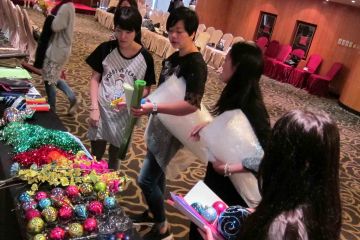 team collaborate to create garments for haute couture team building activity