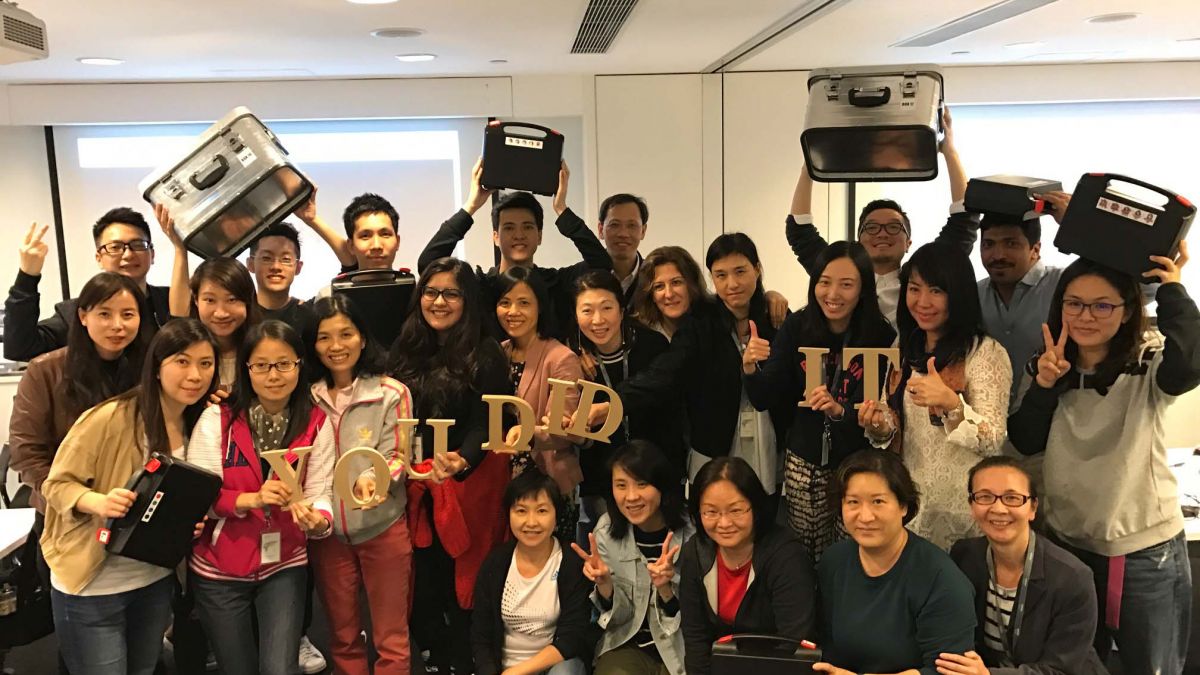 employees celebrate rewarding teamwork