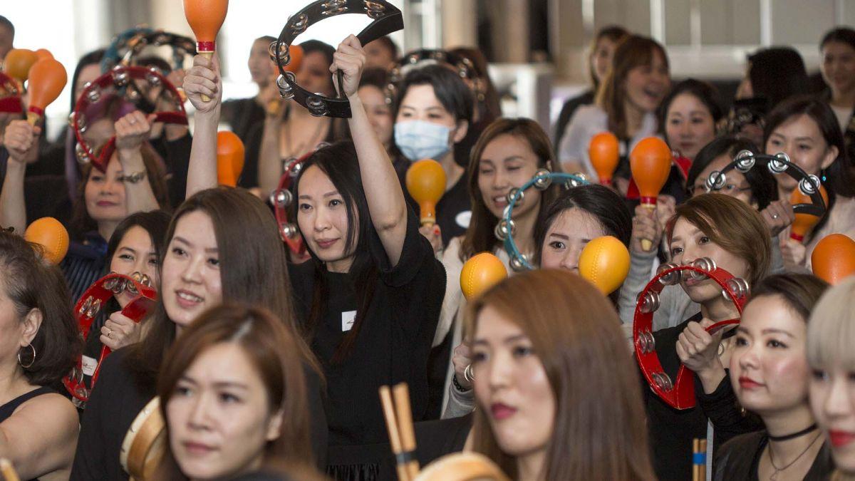 employees participate in energising icebreaker music