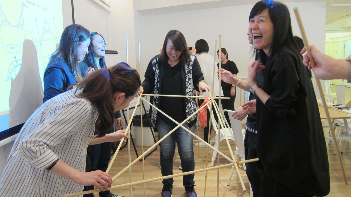 employees collaborating team building activity