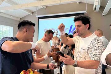 Employees networking across teams and departments through collaborative challenges