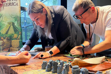 Colleagues working together to solve problems and complete team building challenges.