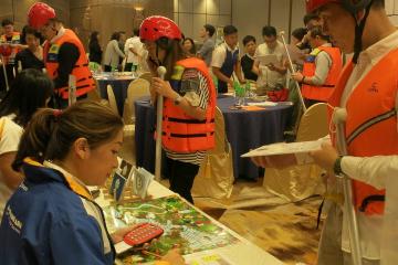 People in life vests at trading table