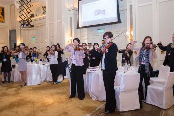 people playing instruments crescendo musical team building activity