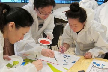 team collaborate to draw a giant picture creative team building activity