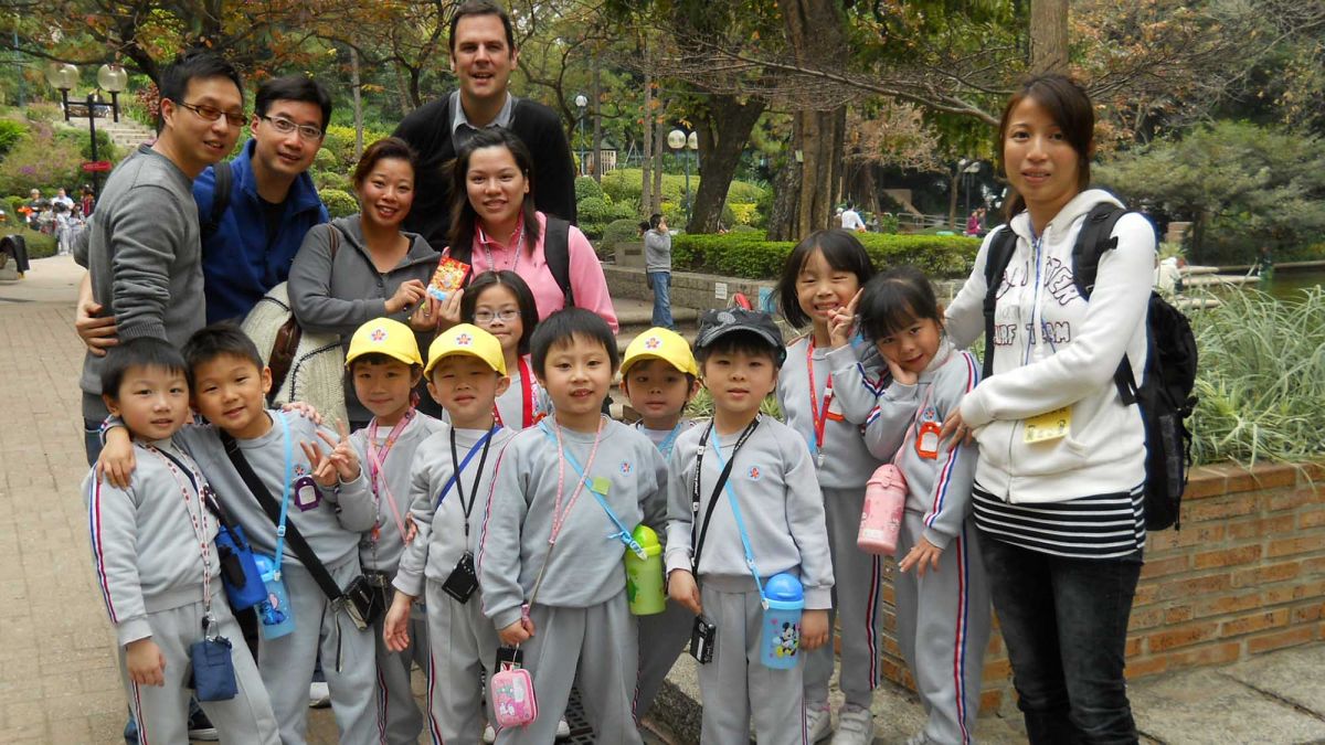 employees with group of children CSR activity
