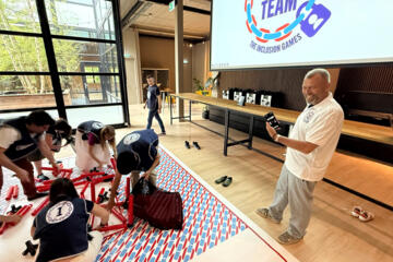 Participants reviewing team performance after a collaborative challenge