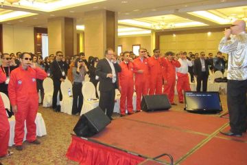 team practising to play the harmonica team building musical activity