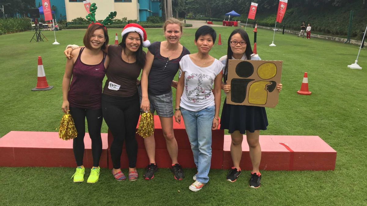 team posing for christmas fun team building activity 