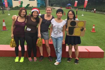 team posing for christmas fun team building activity 