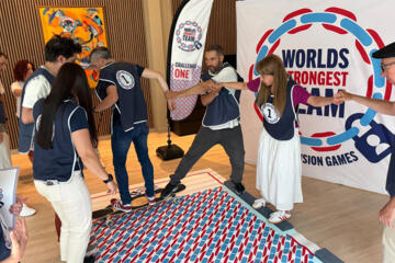 Employees solving problem-solving challenges during World's Strongest Team