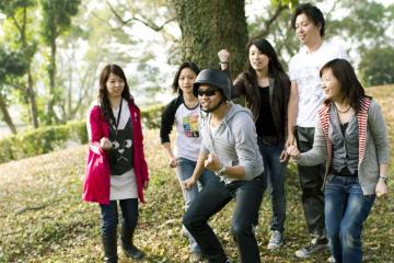 employees collaborate to complete fun team building hollywwod challenge activity holly