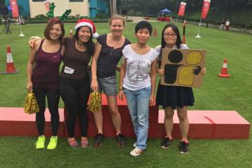 team posing for christmas fun team building activity xmas