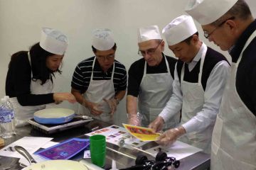 sausage sensation cooking team building activity