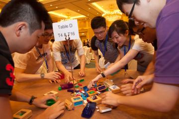 team collaborates to complete fun team building activity need 4 speed