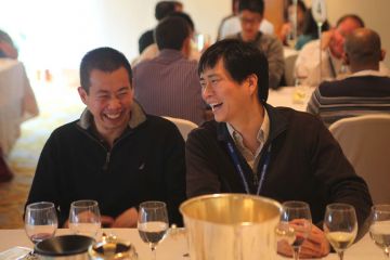 two man laughing at festive team building activity