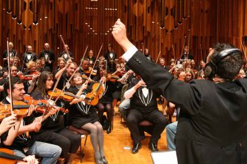 	orchestrate music team building activity